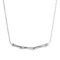 A M A R A sculptural stainless steel necklace on white background 