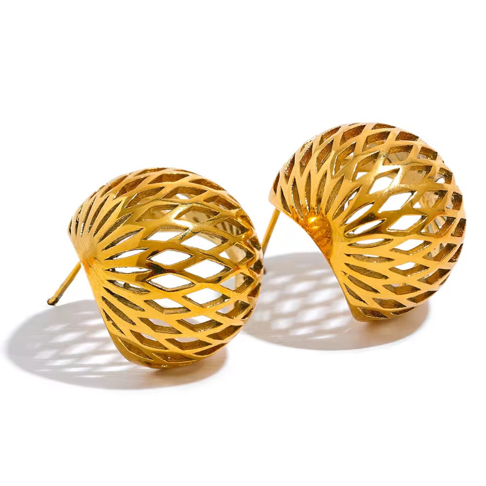 Gold earrings with intricate design on a white background