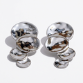 AURELIA stainless steel sculptural statement earrings on white background