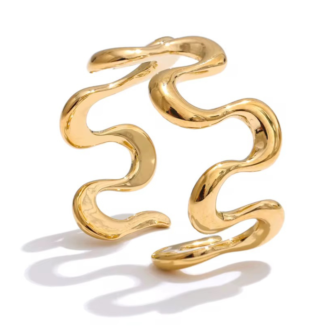 R I V E R sculptural gold plated statement ring on white background