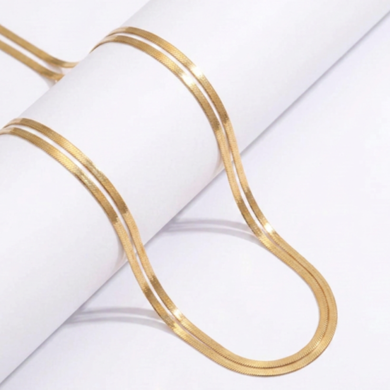 Sayla 18k gold plated luxury waist chain on white background.
